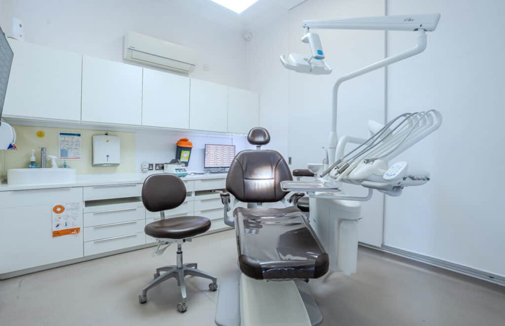 Modern dental treatment room with advanced equipment.